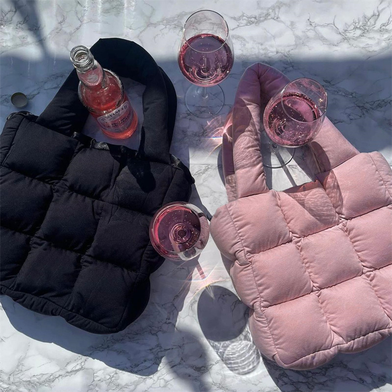 Lightweight padded tote holding drinks